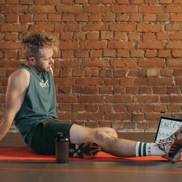 Person smiling and looking relaxed after a gentle exercise session.