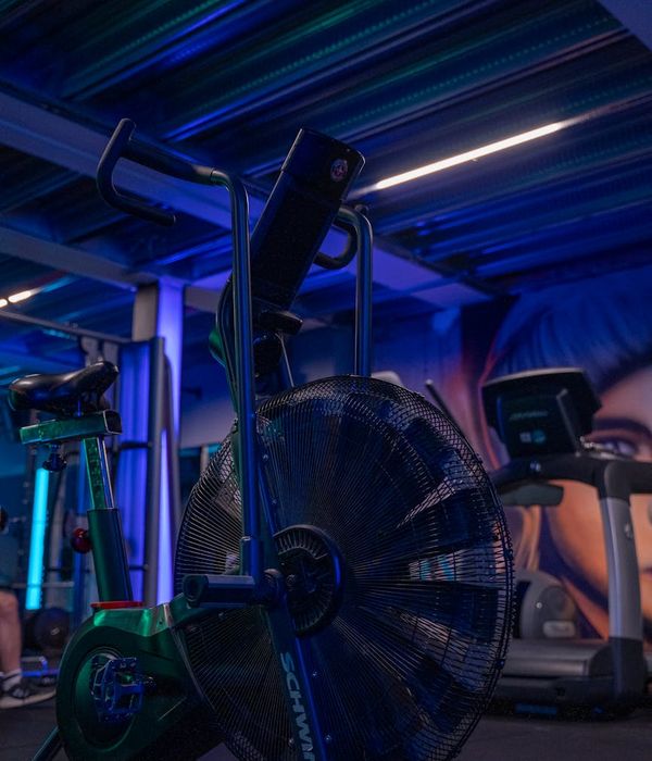 Woman feeling energized during a light cardio workout in a modern studio.